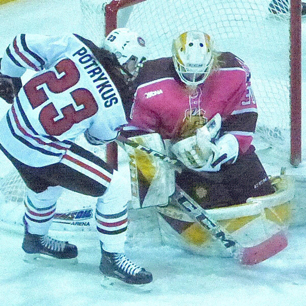 UMD goalie Maddie Rooney stopped St. Cloud’s Hannah Potrykus, but had trouble trapping  the rebound in the Game 2 HJuskies upset. Photo credit: John Gilbert