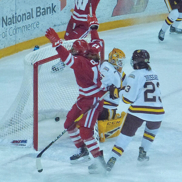 Wisconsin's Emily Clark scored her second goal of the first game against Maddie Rooney in the 6-1 Badger victory. Photo credit: John Gilbert