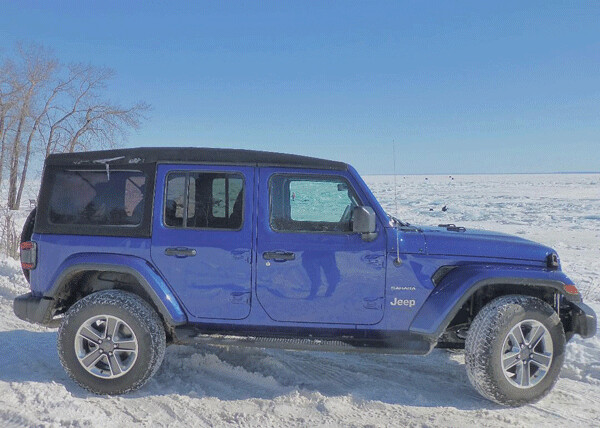 With ice fishermen venturing a mile out from shore, the Wrangler's "Ocean Blue Metallic" contrasts with "Lake Superior February White." Photo credit: John Gilbert