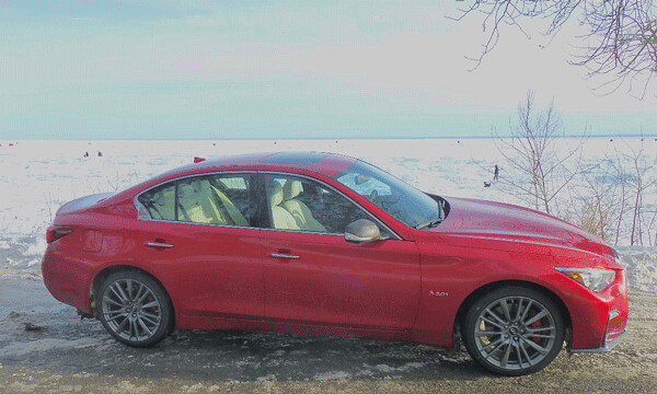 In silhouette against frozen Lake Superior and ice fishermen, the Q50 has AWD but it's definitely a car, not an SUTV. Photo credit: John Gilbert