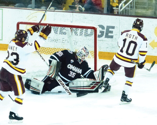 UMD sophomore Kobe Roth comes down after deflecting Mikey Anderson’s shot into  the Miami net for a 2-1 lead in Game 2. Photo credit: John Gilbert