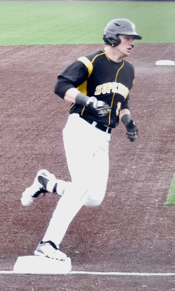 Wisconsin-Superior's Cory Albertson rounded third after his 3-run home run lifted the Yellowjackets to a 5-3 lead in the first game against St. Scholastica. Photo credit: John Gilbert