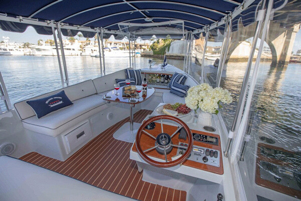 Some newer boats, like this harbor cruiser from Seattle-based Duffy, are greener by virtue of the fact that they are powered by emissions-free all-electric motors. Credit: Duffy Boats.