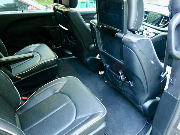 Rear-seat option includes high-backed buckets, separate video screens built into  front headrests. Photo credit: John Gilbert