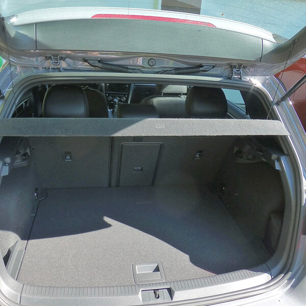 A long, flat surface under the panel-covered hatchback allows lots of stowage,  and the rear seats fold down, too. Photo credit: John Gilbert