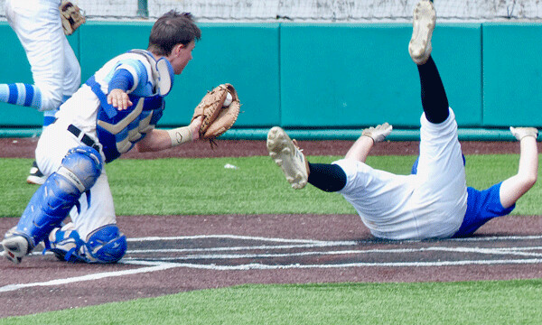  ...Tyler Johnson wound up upside down, as Hukried held the ball high. Photo credit: John Gilbert