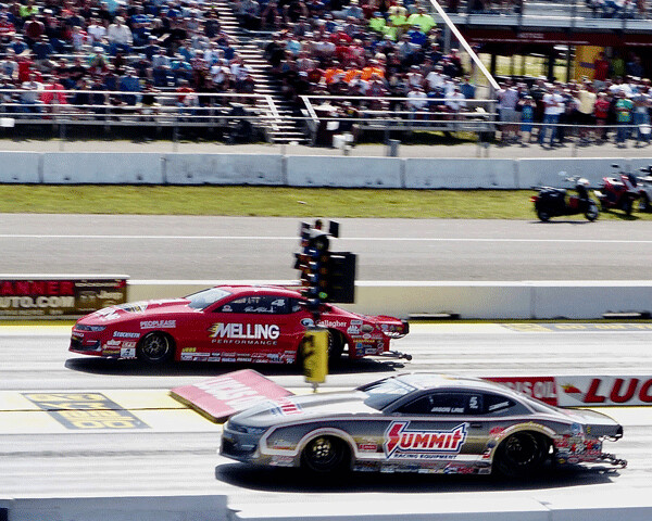 Jason Line, near lane, got off to an even start in Sunday’s Pro Stock final against  Erica Enders, and Line won by .005 seconds. Photo credit: John Gilbert