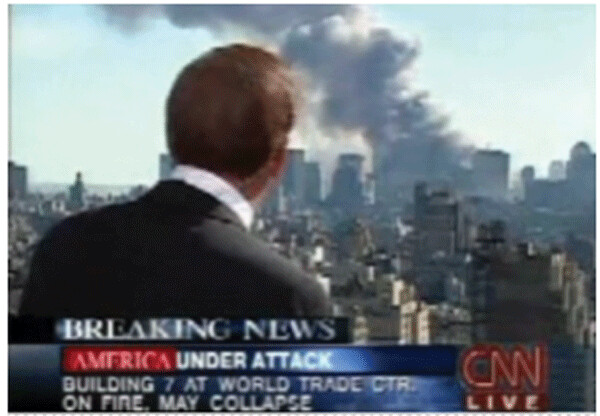 CNN anchor Aaron Brown struggles to make sense of what he is seeing one minute after announcing that WTC # 7 (whose erect facade is clearly visible) “has or is collapsing”