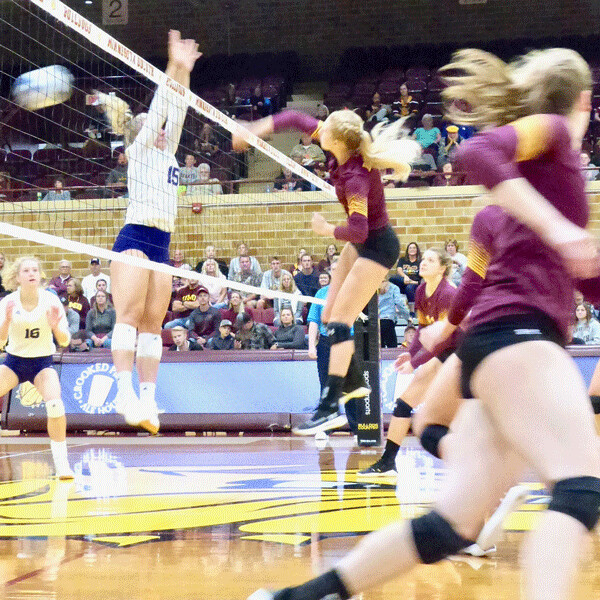 UMD's Emily Balts went high for a kill against Winona State Saturday night at Romano Gym. Photo credit: John Gilbert