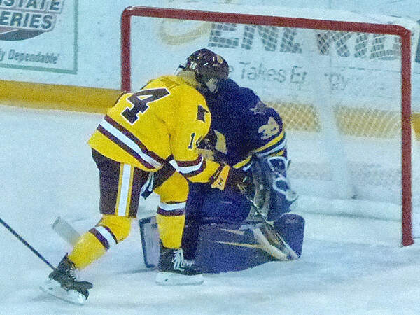 UMD women's captain Sydney Brodt, showing off new yellow jerseys, scored on a breakaway for a 1-1 tie in the second period of the first game against Minnesota State-Mankato. Photo credit: John Gilbert