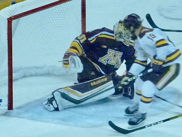 The Bulldogs Justin Richards was in clean but stopped by Gopher freshman goaltender Jared Moe. Photo credit: John Gilber