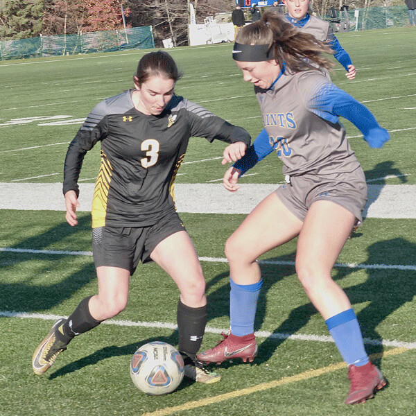 Claire Smith, a UWS sophomore from Hayward, battled St. Scholastica freshman Alexa Ickert for possession in the scoreless first half, before the Saints won 4-0 to clinch the UMAC title. Photo credit: John Gilbert