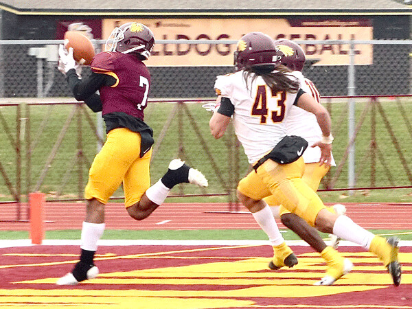 UMD's Quincy Woods gathered in this perfect 27-yard touchdown pass from freshman Keagan Calchara to help form a 42-0 halftime lead. Photo credit: John Gilbert