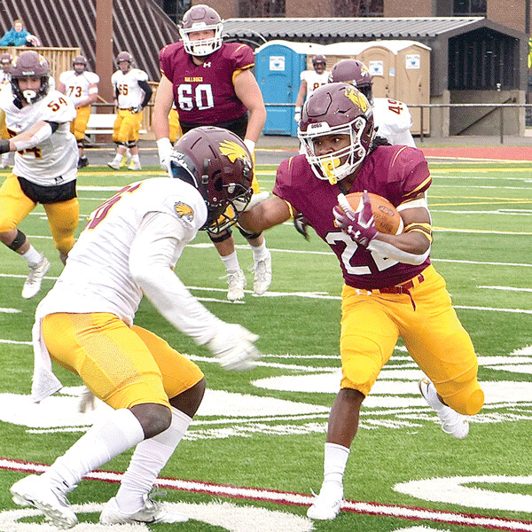 Cazz Martin barreled through Crookston defense for two touchdowns and was one of three Bulldogs over 100 yards rushing. Photo credit: John Gilbert