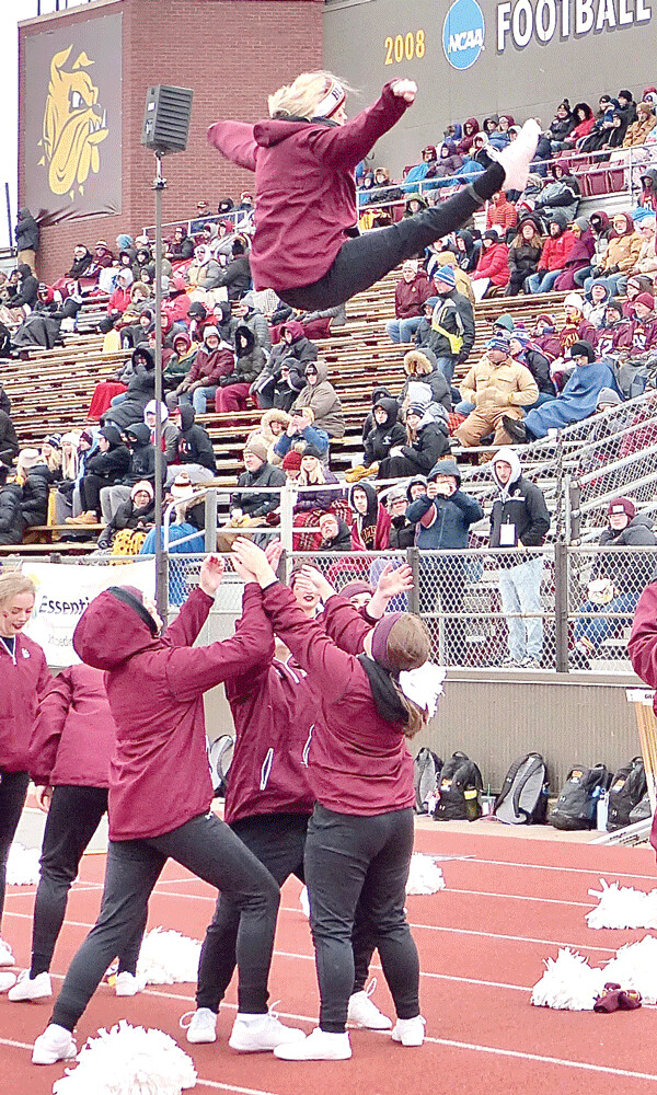UMD cheerleaders found an interesting way to keep warm at halftime, giving new meaning to "fair catch." Photo credit: John Gilbert