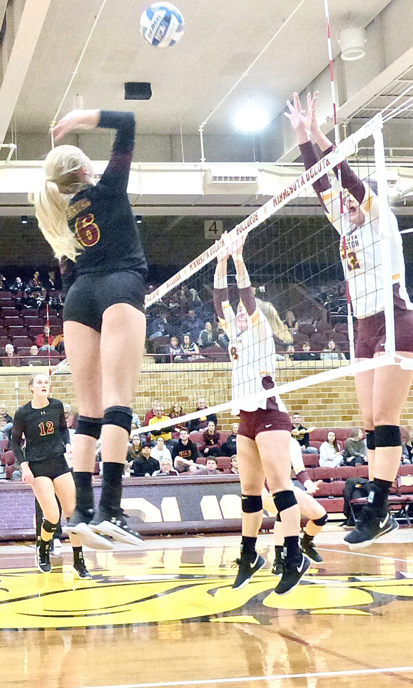 Hanna Meyer delivered a kill through the double block of Crookston's Kaitlin Sikkink and Porsha Porath (12) in UMD's 3-0 sweep. Photo credit: John Gilbert