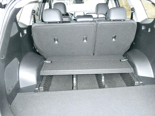  Under the hatch, the flat floor, which can be expanded by folding down the second row from the rear of the vehicle, also has compartments under the floor for stowing stuff. Photo credit: John Gilbert