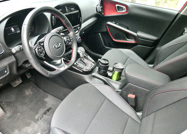 Sporty interior features leather seats and sports steering wheel on Soul GT. Photo credit: John Gilbert