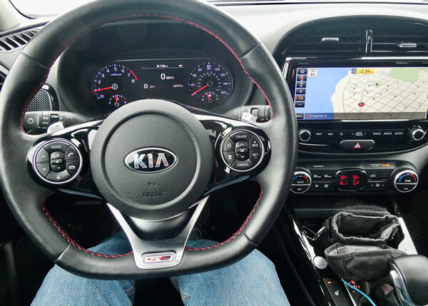 All necessary switchwork is included on the steering wheel, and expansive navigation screen is easily read. Photo credit: John Gilbert