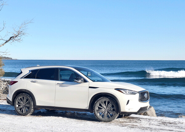Glistening metallic white and Lake Superior backdrop sets off the 2020 Infiniti QX50 with high-tech variable compression 4-cylinder engine. Photo credit: John Gilbert