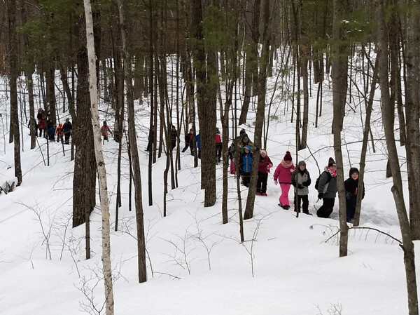 Third graders from Hayward learn about winter adaptations of animals on a snowshoe field trip with the Cable Natural History Museum. Photo by Emily Stone.