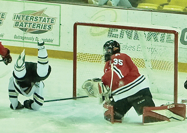  ...and crashed to the ice, but he jumped up and, seconds later, scored to ignite a 6-goal second period for an 8-1 Andover victory. Photo credit: John Gilbert