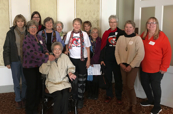 Jan Provost in her wheelchair with some of her friends and fellow activists.