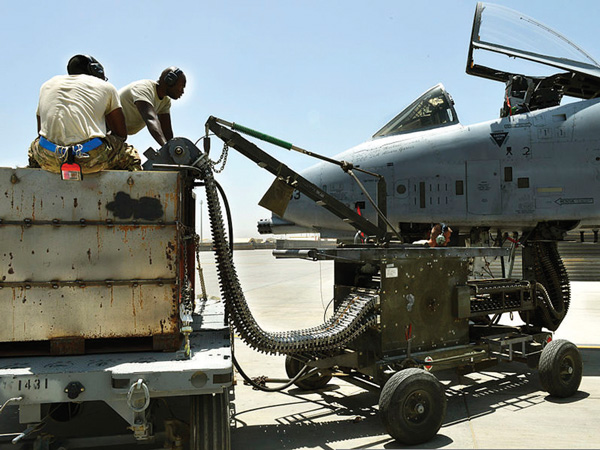 Airmen loading uranium-238 “depleted uranium” shells onto a warplane called the A-10 Warthog, which can fire 4,200 rounds per minute.