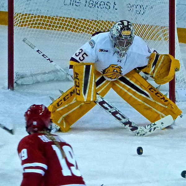 UMD sophomore Maddie Rooney stopped Wisconsin’s Annie Pankowski and faced 46 shots while beating the Badgers 4-1, then faced 47 more in a 4-1 setback. Photo credit: John Gilbert