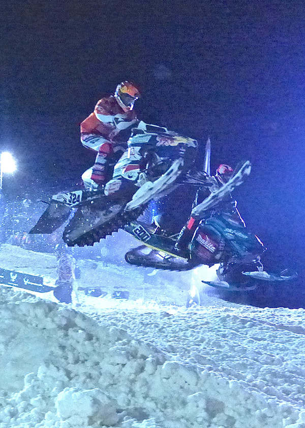 Kyle Pallin (foreground) flew his Polaris over the final jump as he battled 18-year-old Norwegian Elias Isohel, who won the Dominator in his first Pro Am event. Photo credit: John Gilbert
