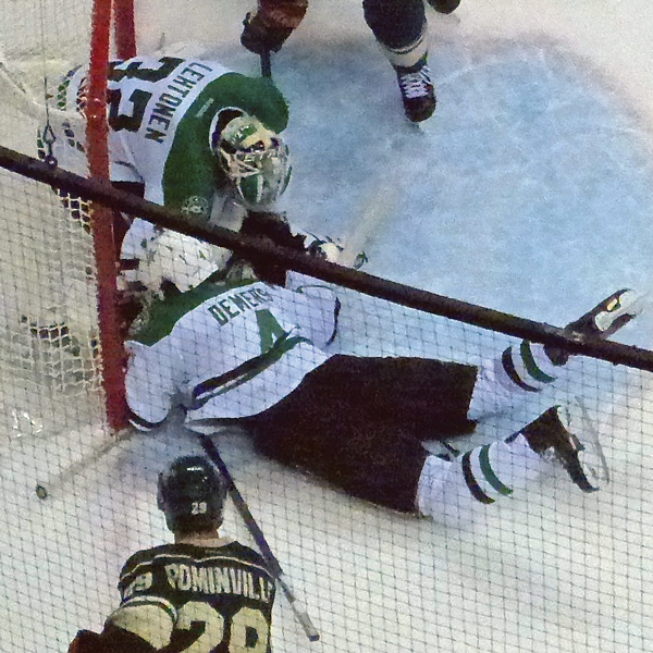 When Dallas goalie Kari Lehtonen couldn't cover Nico Niederreiter's shot with 33.9 seconds left, defenseman Jason Demers (4) dived into the crease to cover the puck. Photo Credit: John Gilbert