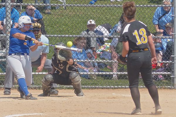 Sarah Hendrickson's final pitch of the UMAC championship game was met squarely by St. Scholastica's Nikki Logergren.