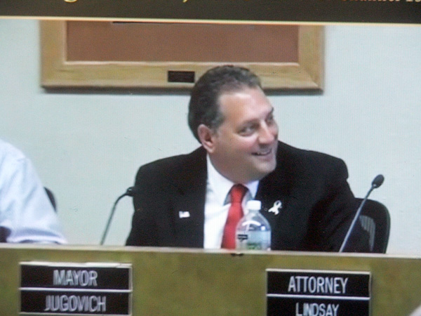 Chisholm Mayor Mike Jugovich smirks after publicly berating a citizen  who criticized him on Facebook